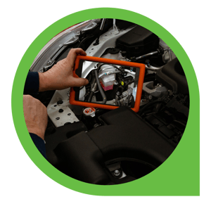 tablet taking pictures of vehicle part under hood of car 