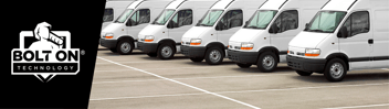 white fleet trucks in a parking lot 